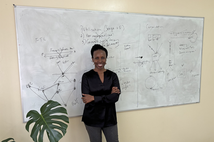 June Odongo Senga in front of whiteboard